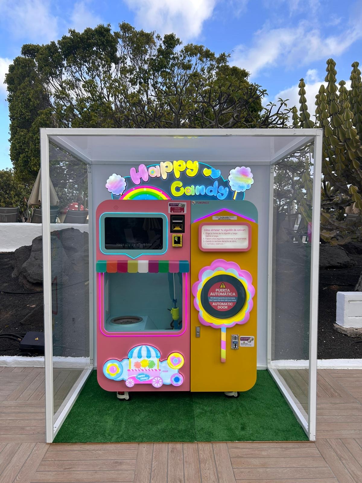 Robites automated cotton candy vending machine installed in a glass enclosure